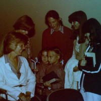 The Wood twins visit with Joni Eareckson Tada. Joy Wood is in the red sweater. Northwoods, 1980